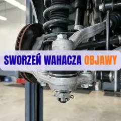Widok na zawieszenie samochodu z widocznym sworzniem wahacza. Tekst "SWORZEŃ WAHACZA OBJAWY" informuje o problemach z tym elementem.