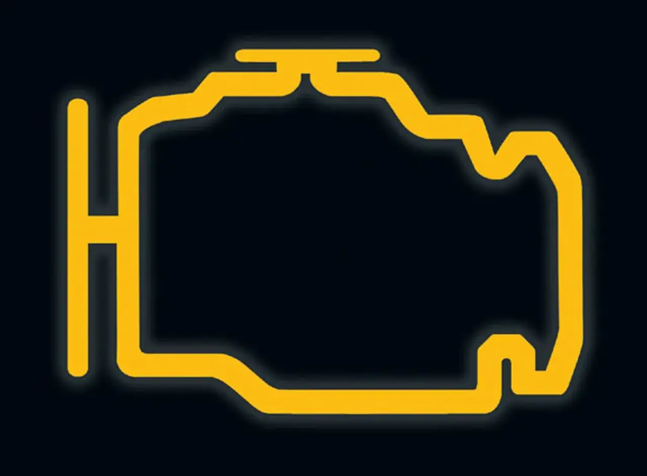 Żółty symbol silnika na ciemnym tle. Dowiedz się, jak skasować błąd check engine bez komputera.